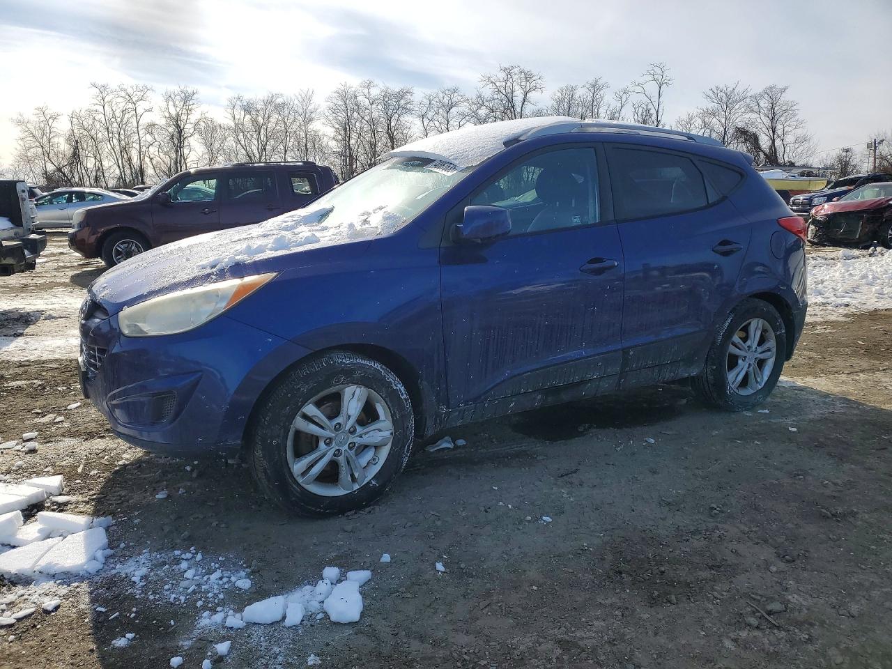 2011 Hyundai Tucson VIN KM8JUCAC5BU132164 photo 1