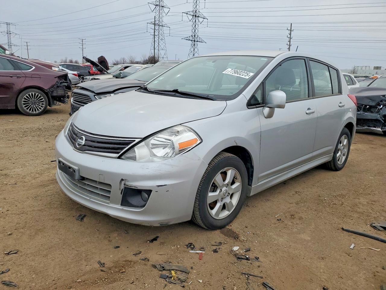 2010 NISS Versa VIN 3N1BC1CP0AL385601 photo 1