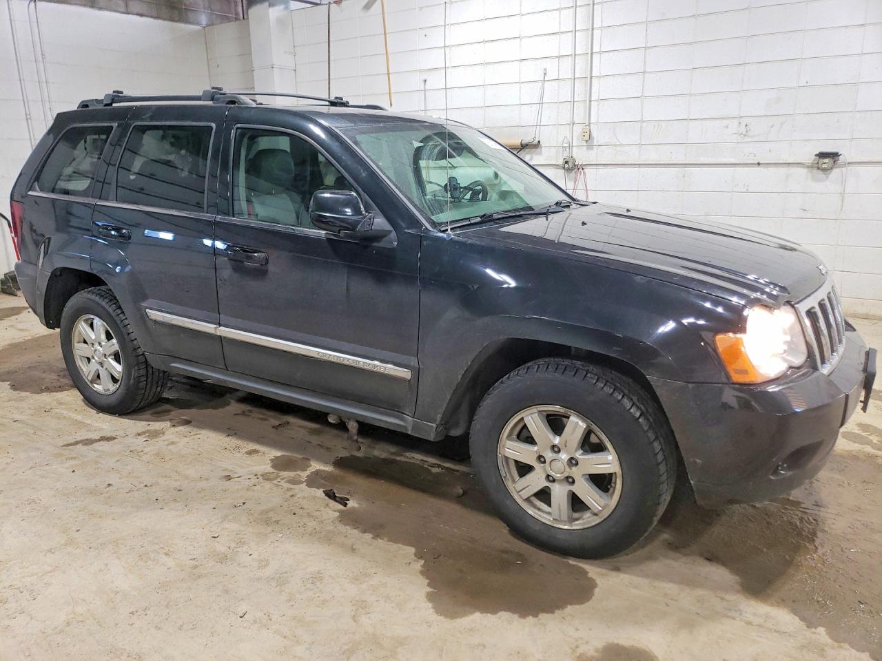 2009 Jeep Grand cher VIN 1J8HR58P69C550895 photo 4