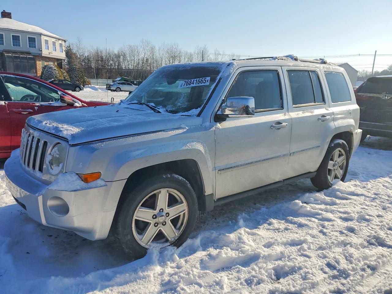 2010 Jeep Patriot VIN 1J4NF4GBXAD501680 photo 1