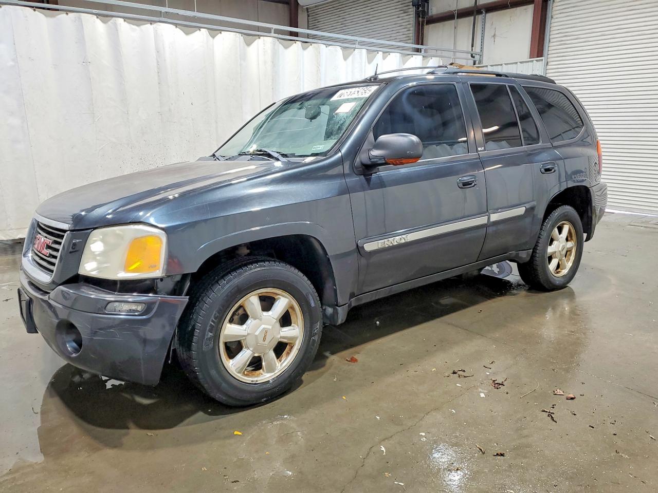 2005 GMC Envoy VIN 1GKDT13S152302912 photo 1