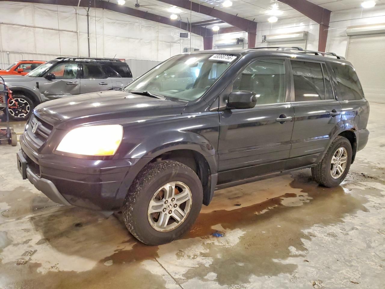 2004 Honda Pilot VIN 2HKYF18404H559457 photo 1