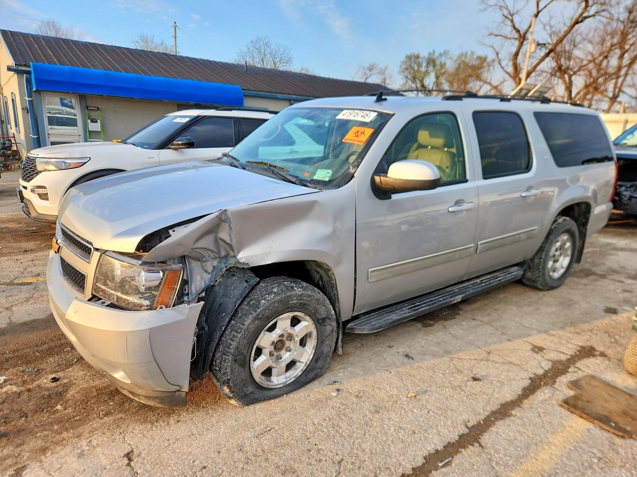 2012 Chevrolet Suburban VIN 1GNSKJE76CR152483 photo 1