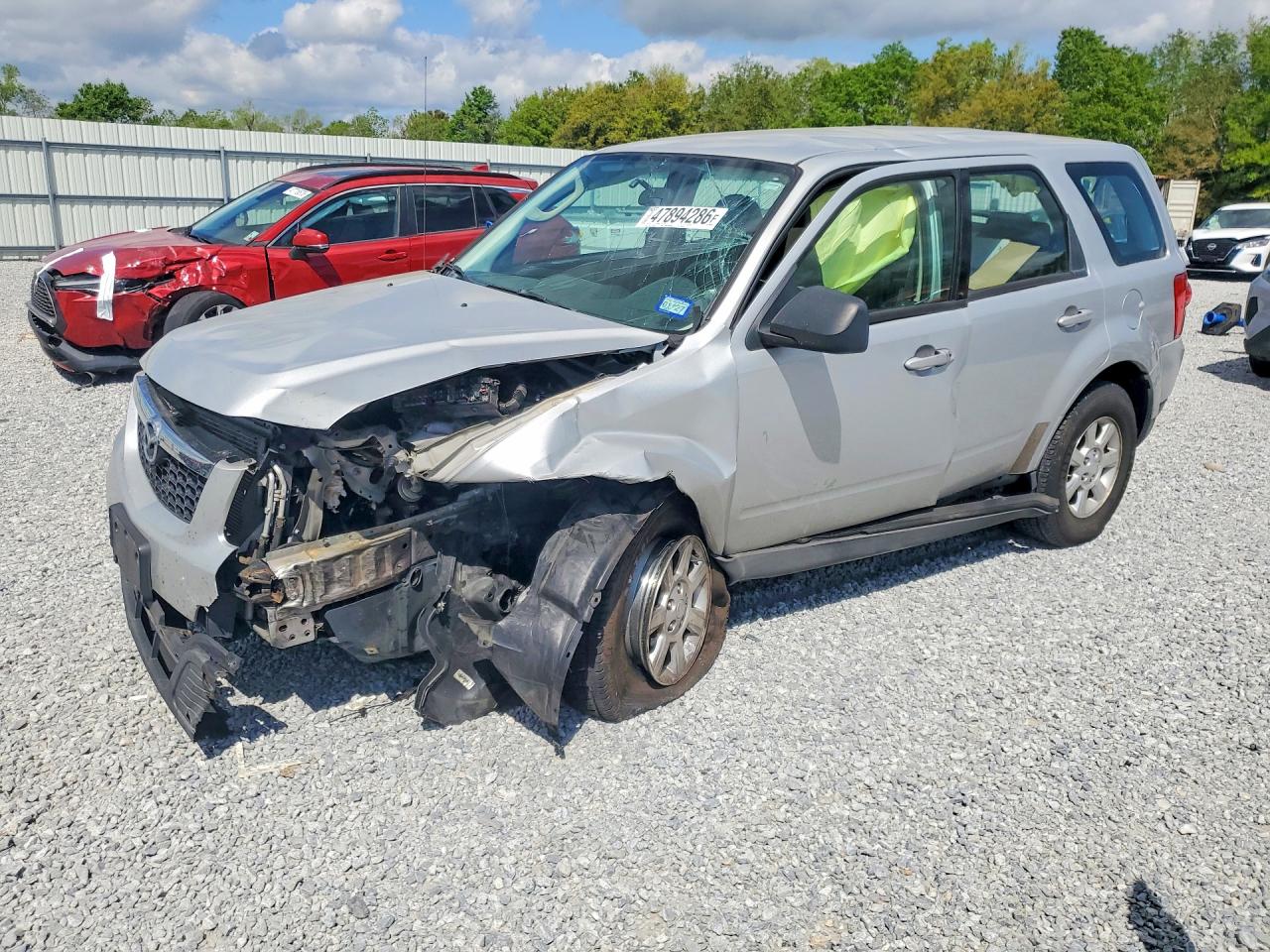 2009 Mazda Tribute VIN 4F2CZ02769KM09344 photo 1