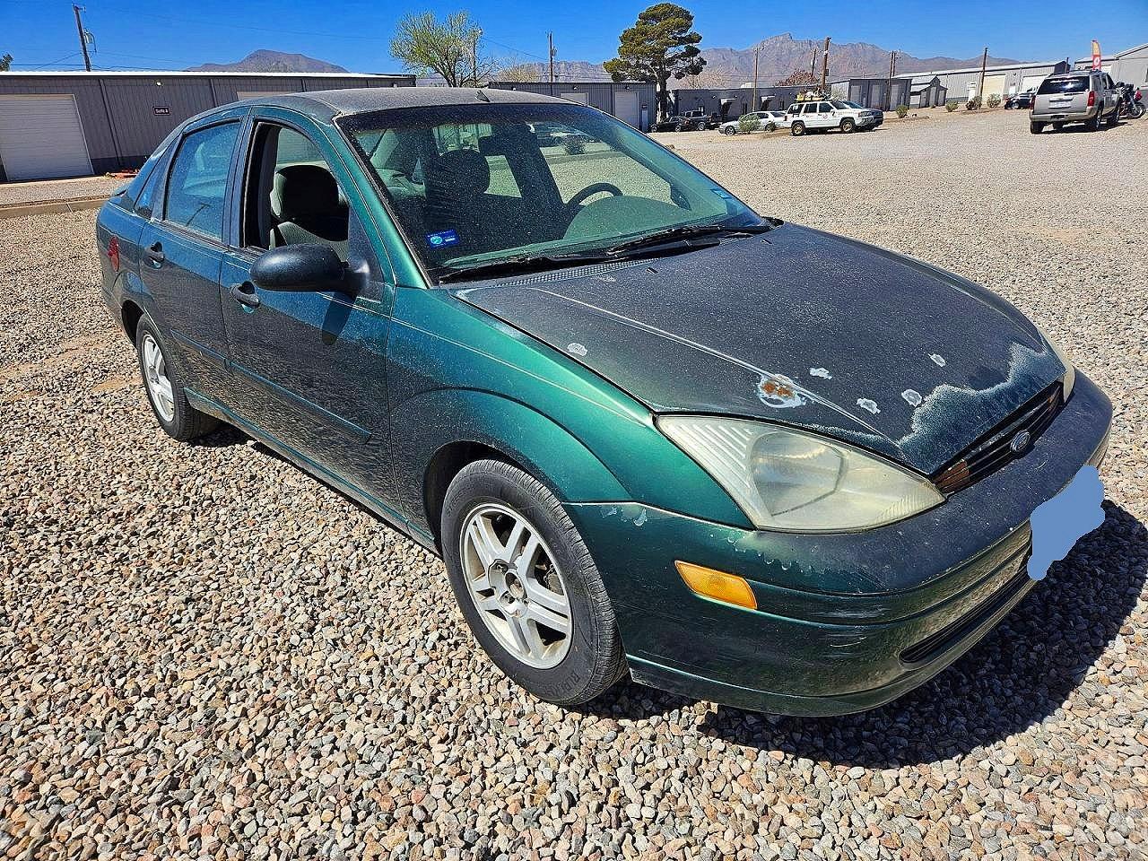 2000 Ford Focus VIN 1FAFP3433YW219500 photo 1