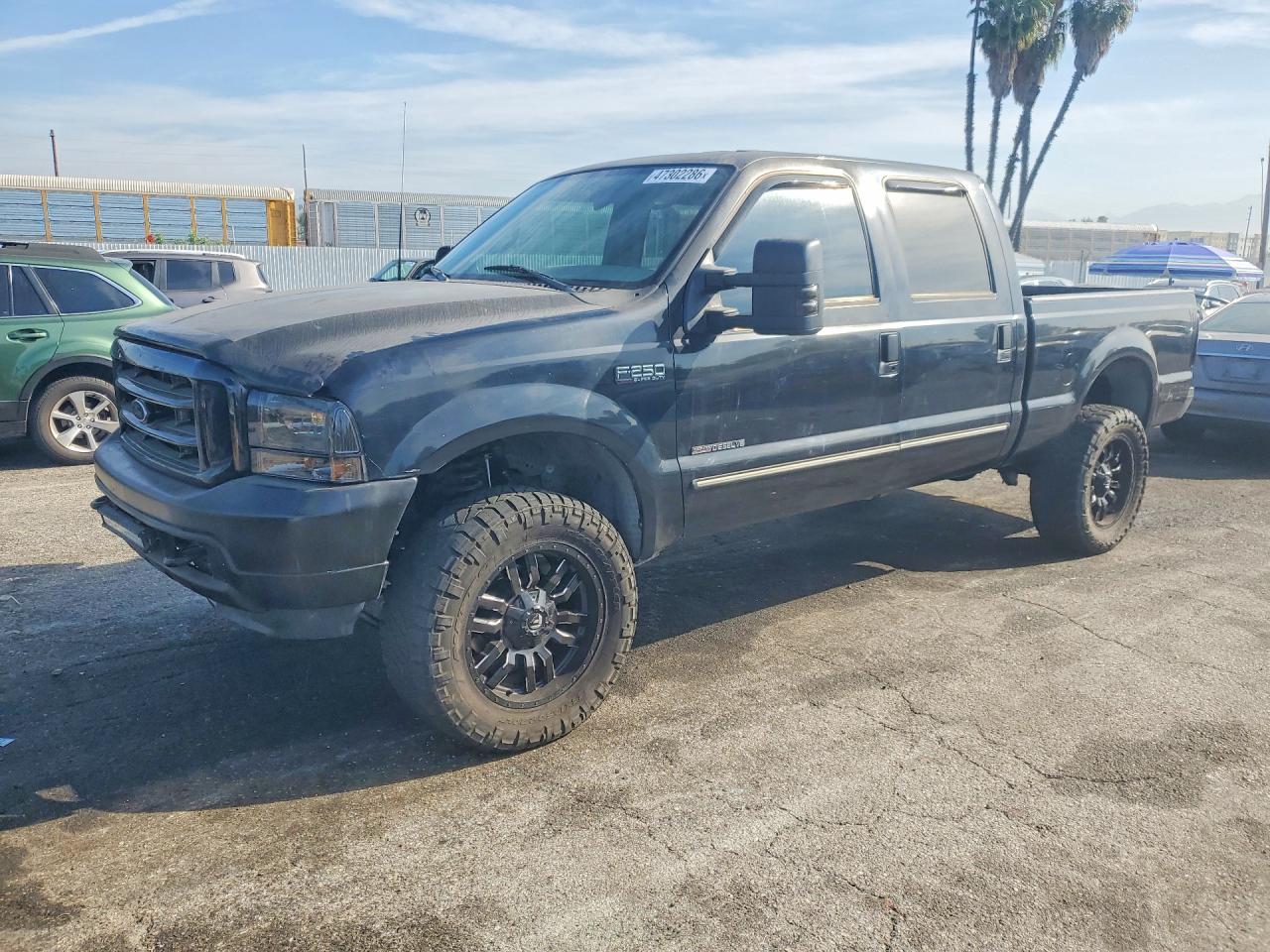 2000 Ford F250 VIN 3FTNW20F1YMA57143 photo 1