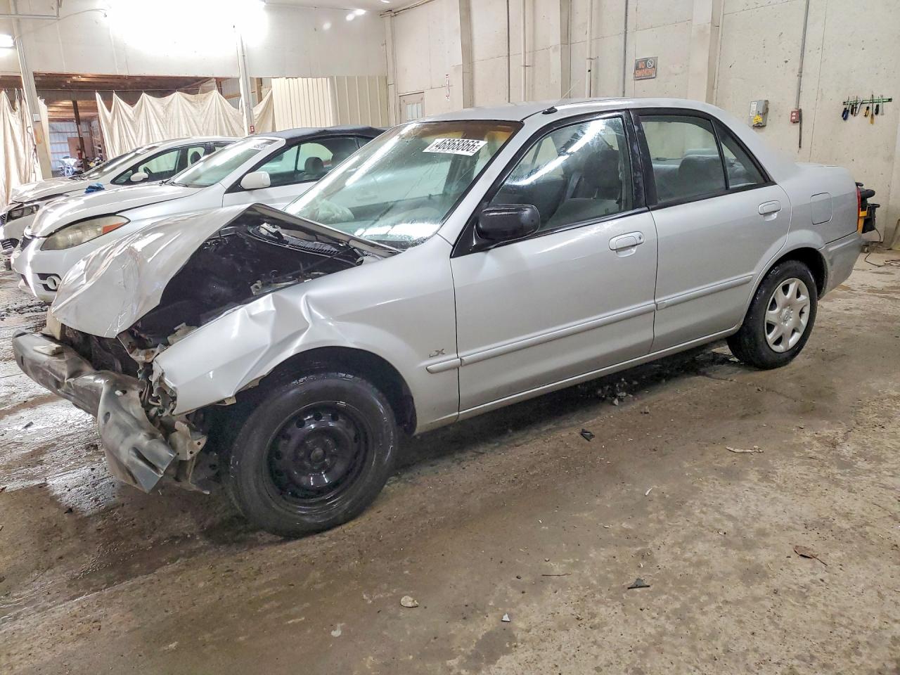 2000 Mazda Protege VIN JM1BJ222XY0297516 photo 1