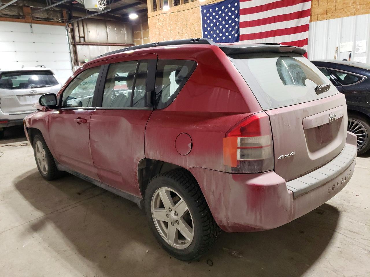 2010 Jeep Compass VIN 1J4NF4FB9AD601674 photo 2