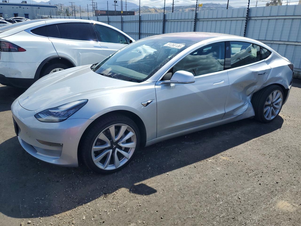2017 Tesla Model 3 VIN 5YJ3E1EA9HF000985 photo 1