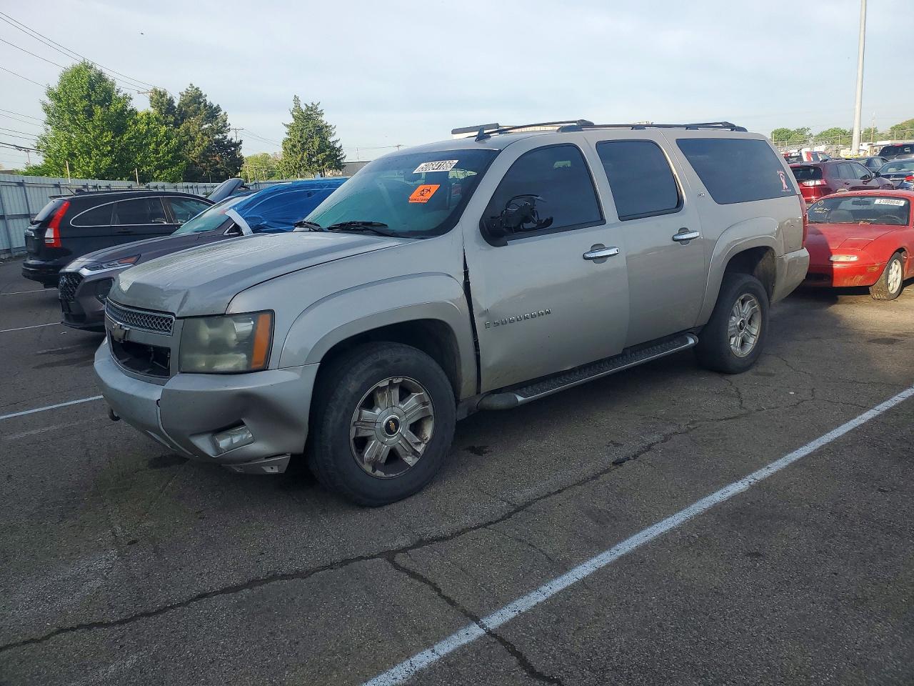 2009 Chevrolet Suburban VIN 1GNFK26309R135433 photo 1