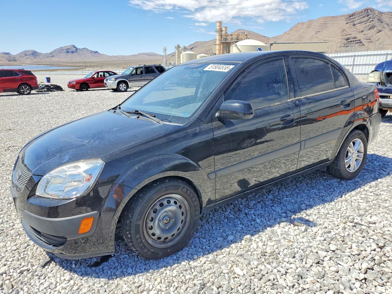 2009 Kia Rio VIN KNADE223696469459 photo 1