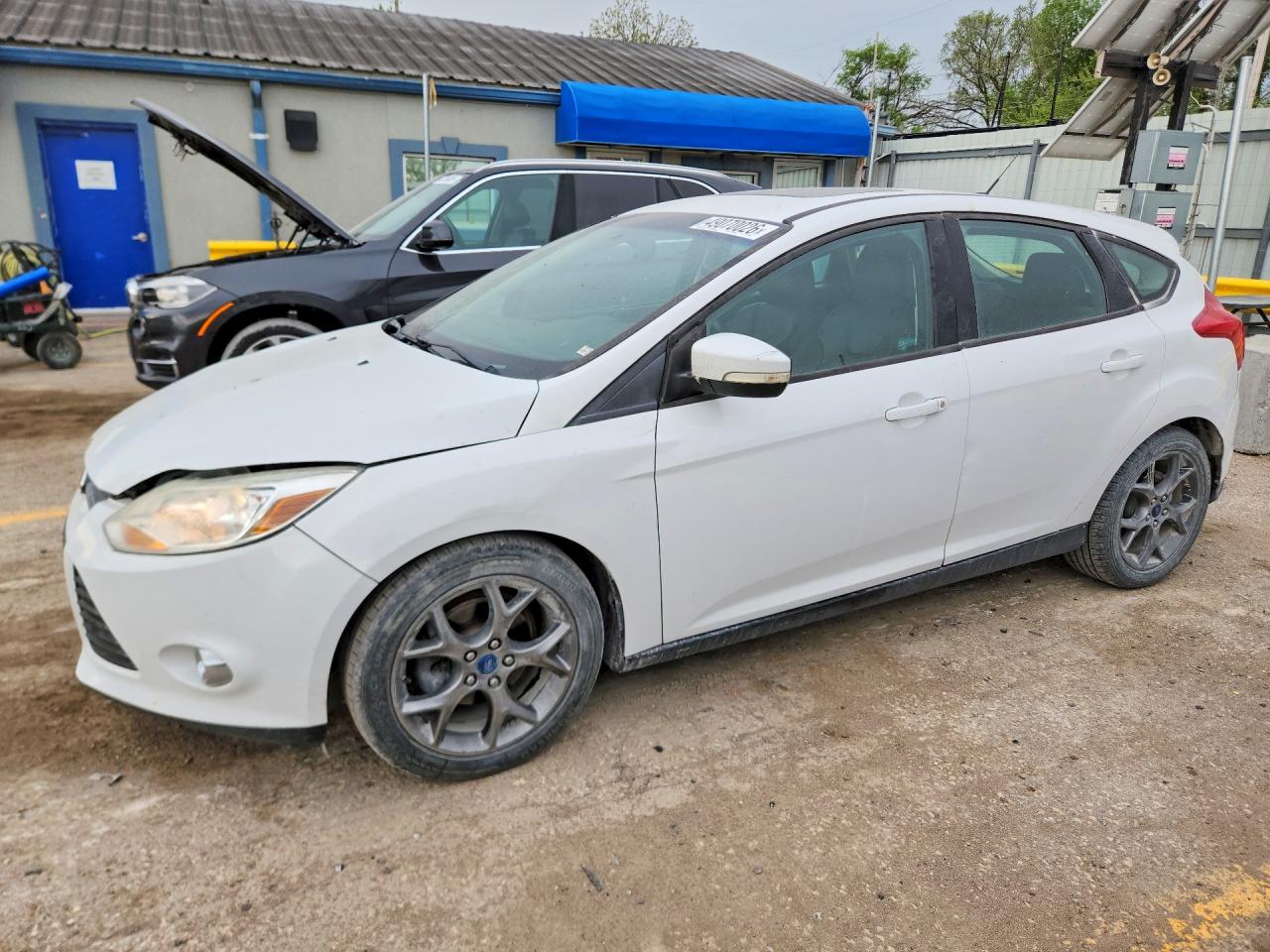 2013 Ford Focus VIN 1FADP3K29DL214041 photo 1