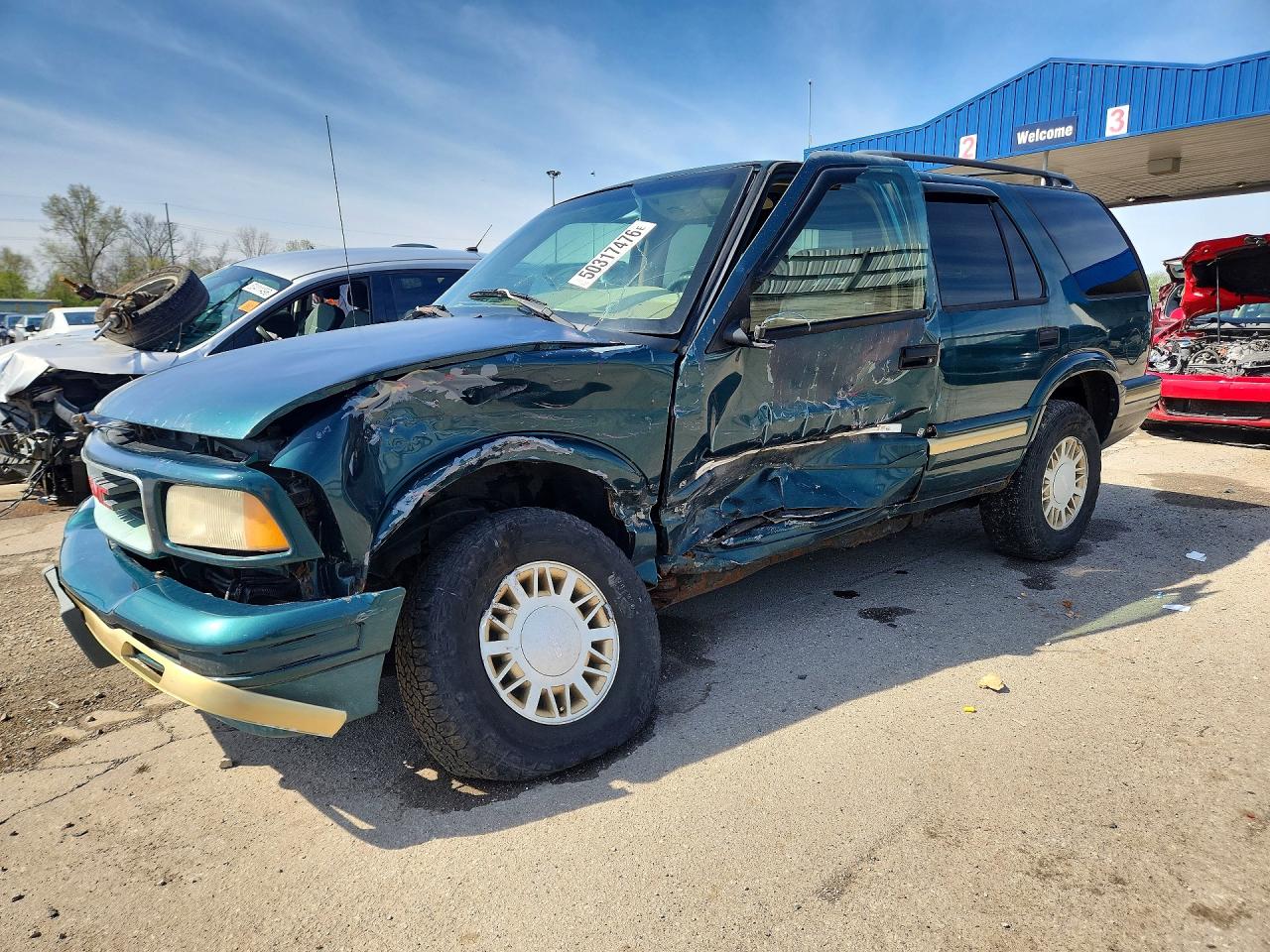 1997 GMC Jimmy VIN 1GKDT13W2V2563131 photo 1