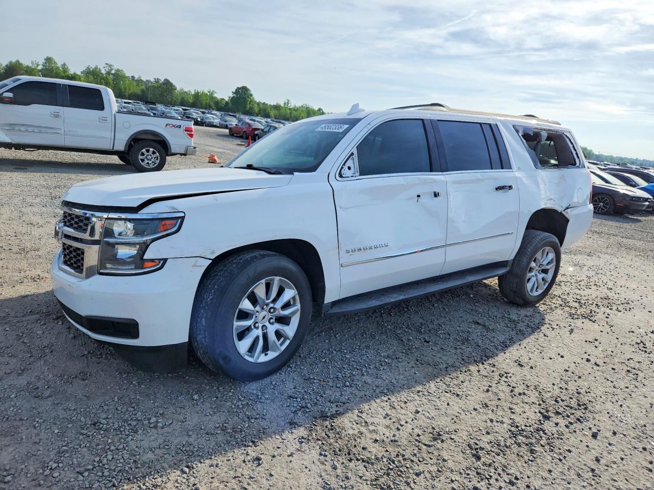 2019 Chevrolet Suburban VIN 1GNSKHKCXKR148090 photo 1
