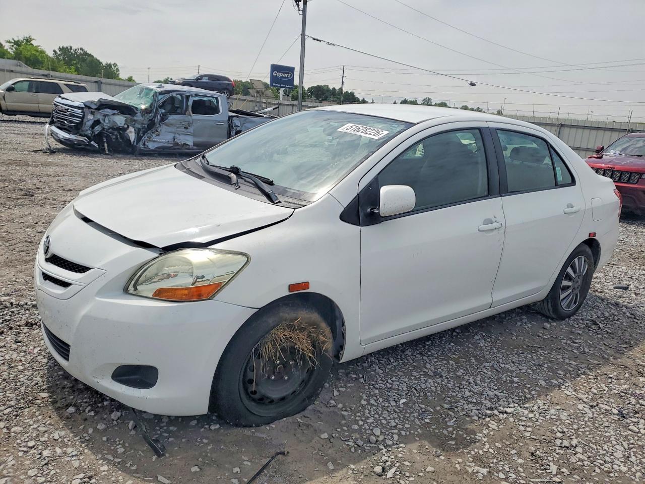 2009 TOYT Yaris VIN JTDBT903491325711 photo 1