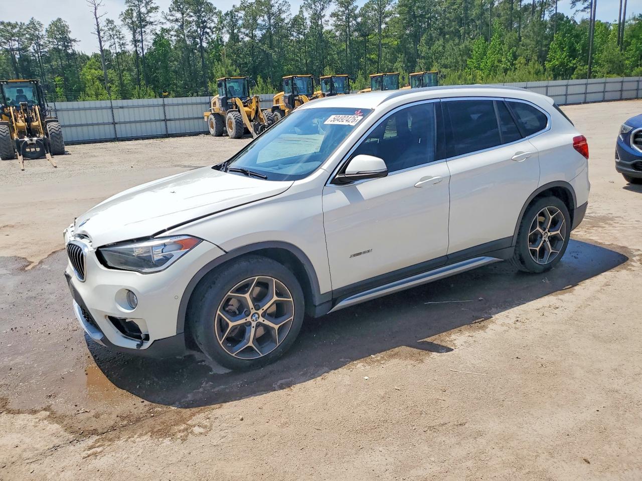 2016 BMW X1 VIN WBXHT3C35G5E56192 photo 1
