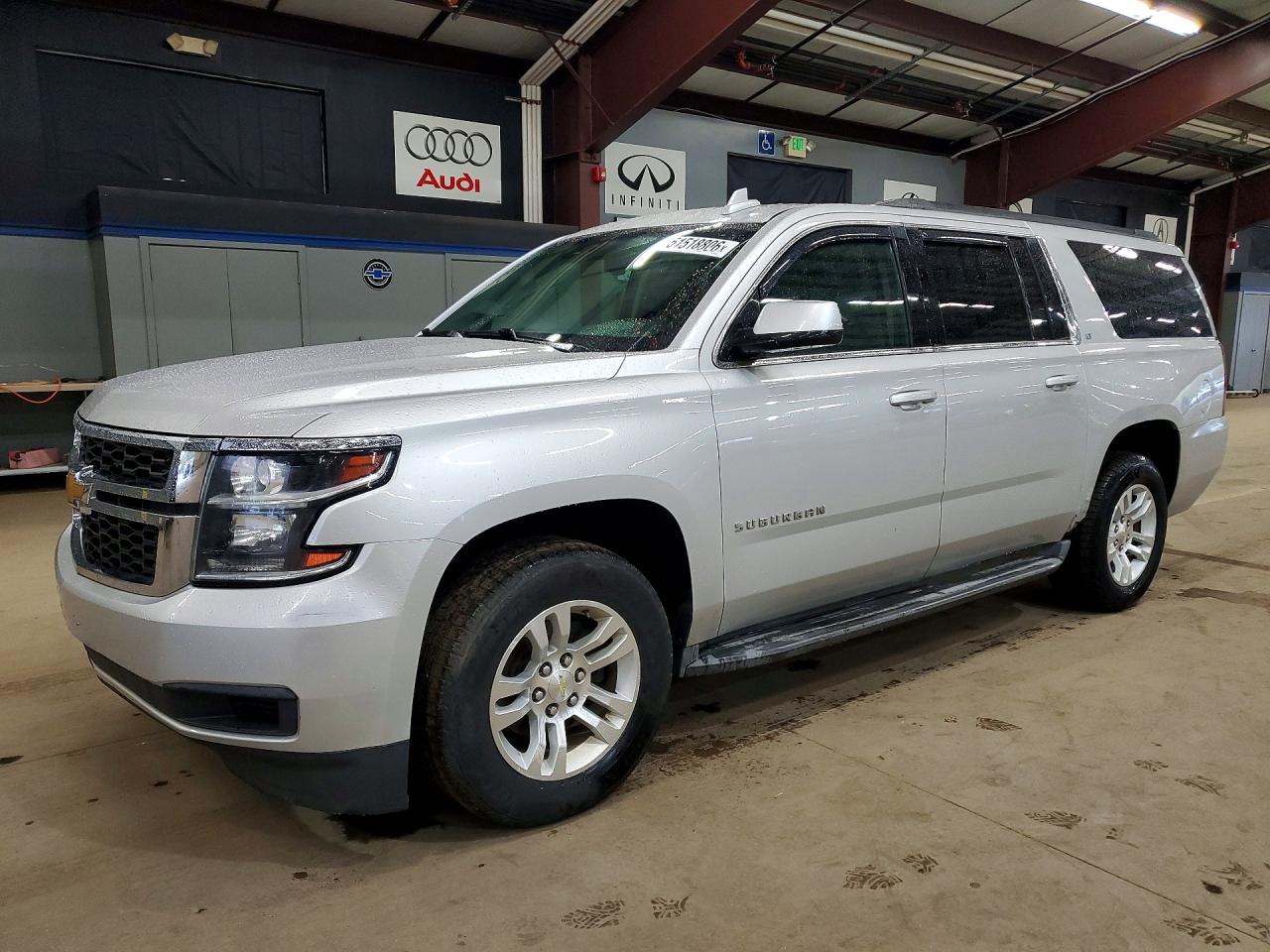 2015 Chevrolet Suburban VIN 1GNSKJKC8FR556990 photo 1