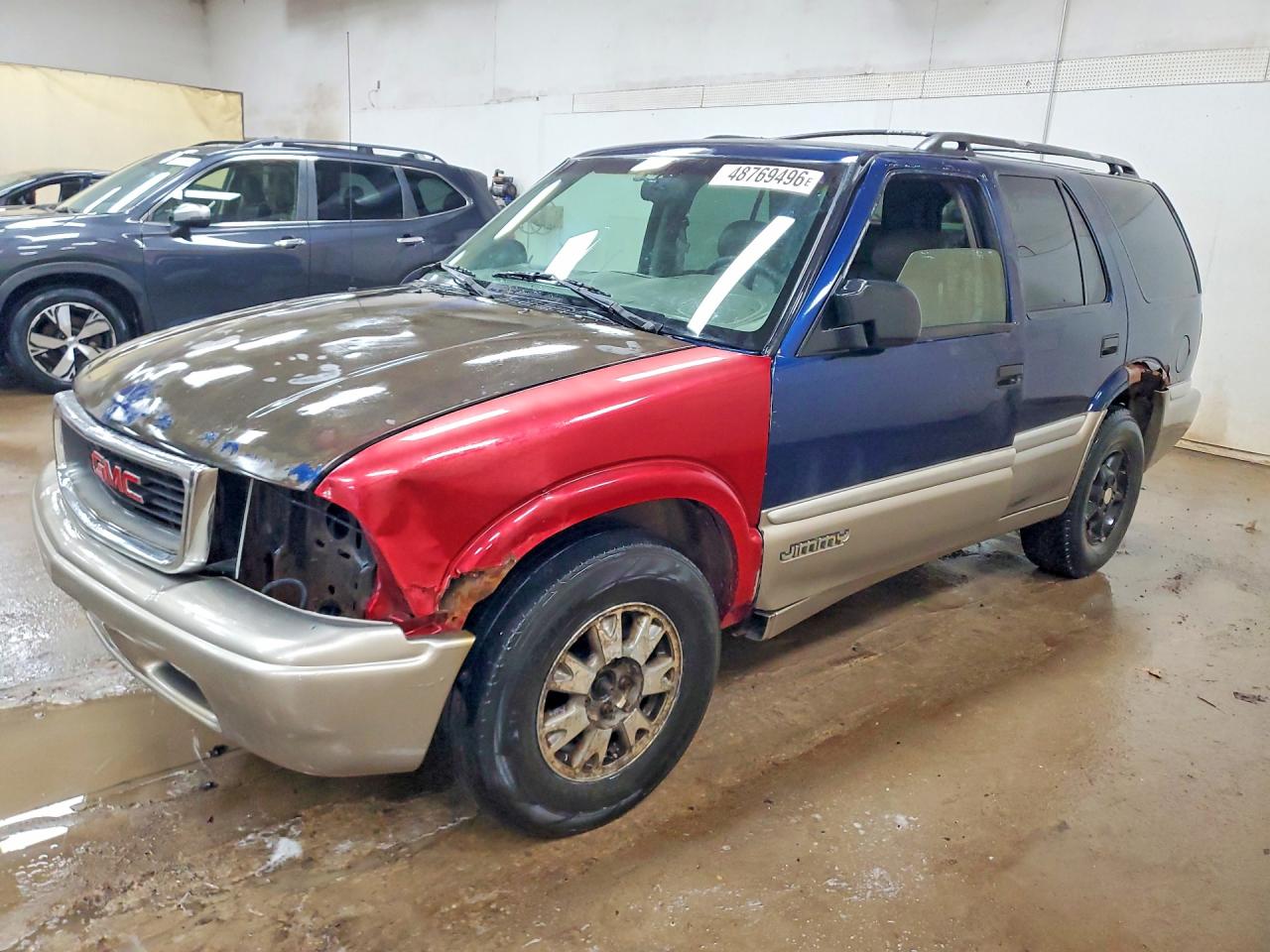 1999 GMC Jimmy VIN 1GKDT13W3X2557793 photo 1