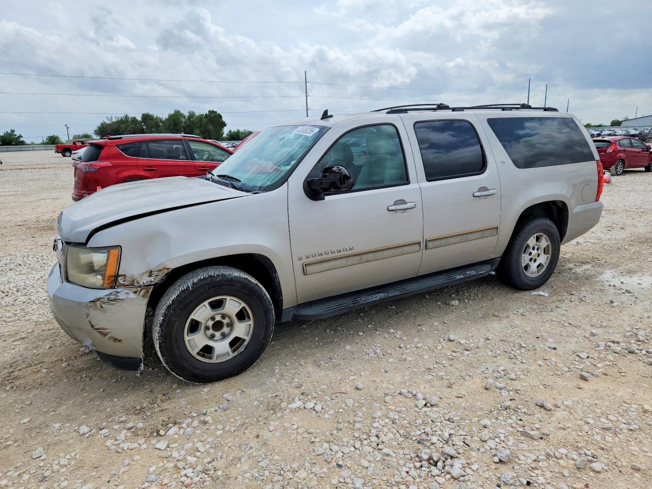 2009 Chevrolet Suburban VIN 1GNFC26029R273641 photo 1