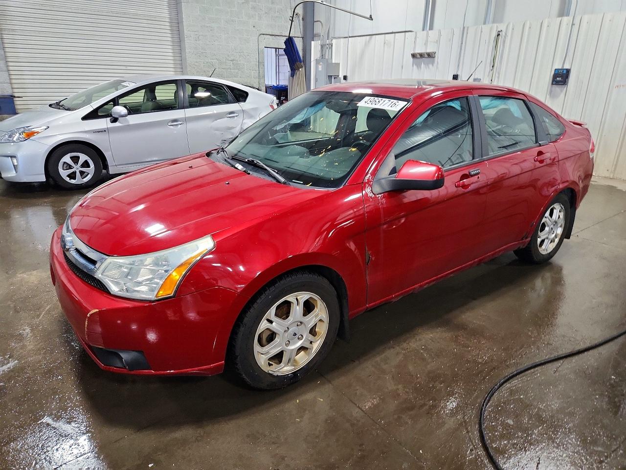 2009 Ford Focus VIN 1FAHP36N79W263847 photo 1