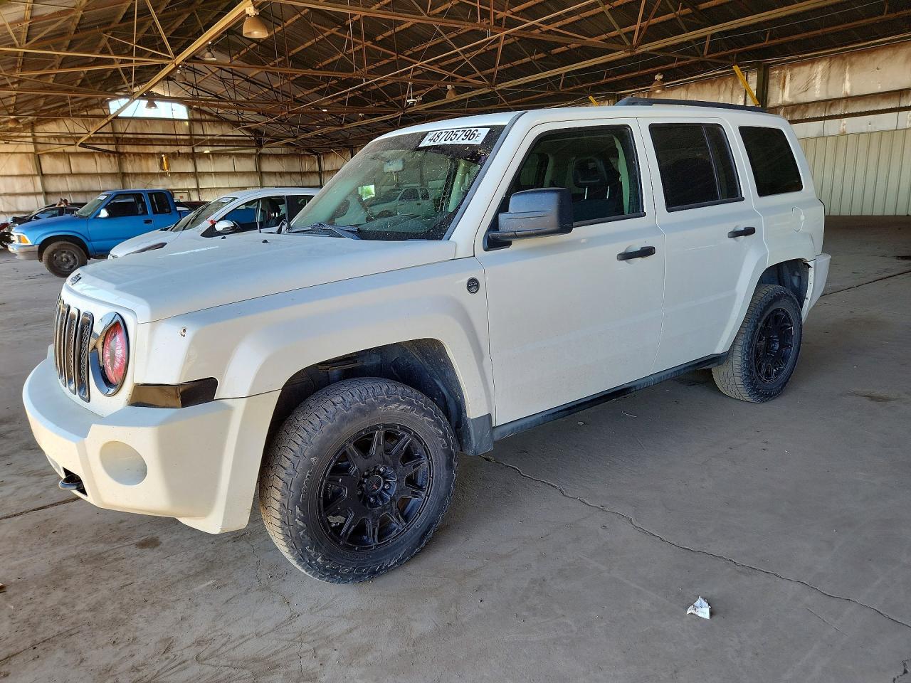2009 Jeep Patriot VIN 1J4FF28B69D249591 photo 1