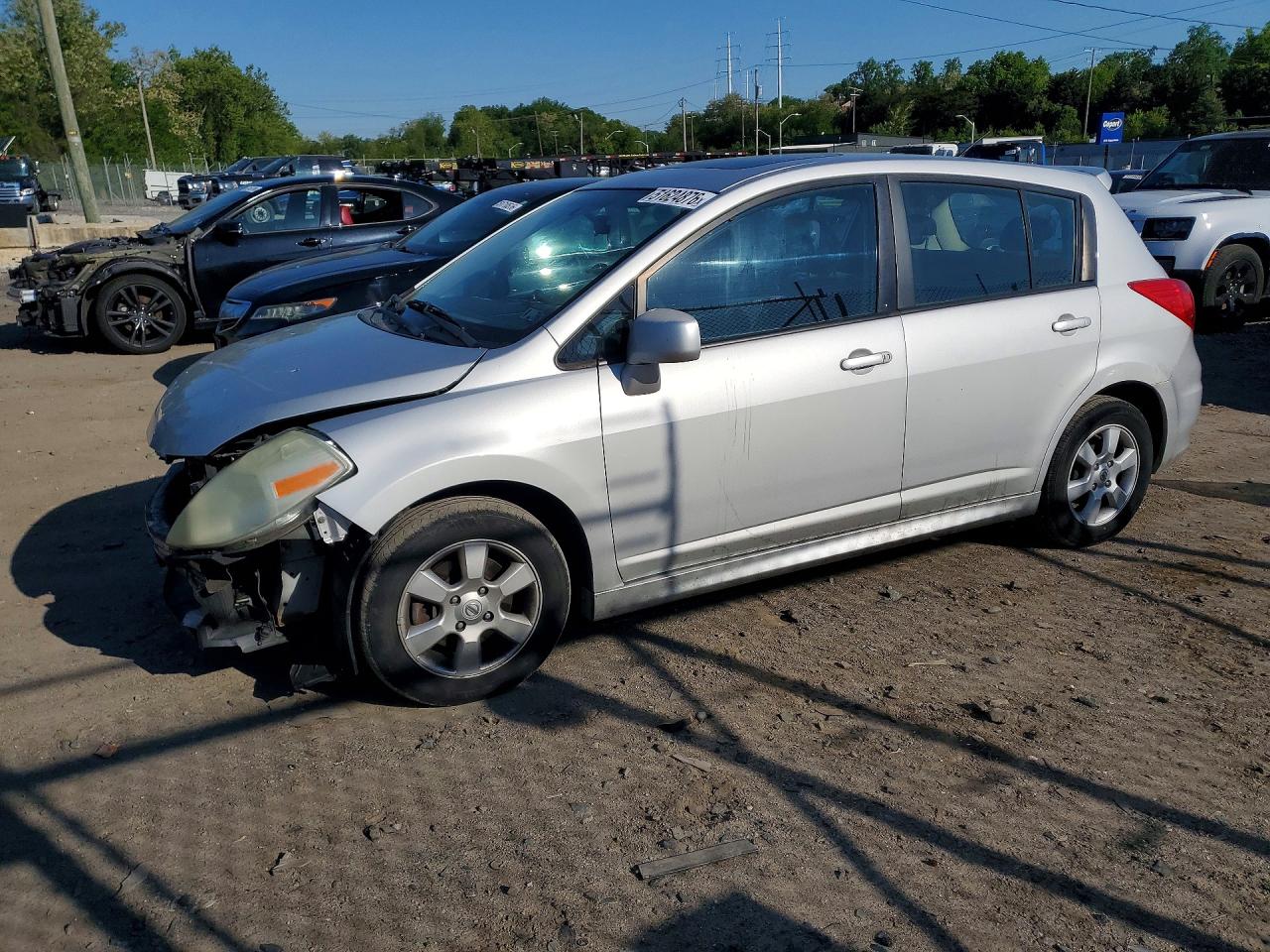 2009 Nissan Versa VIN 3N1BC13E39L372772 photo 1