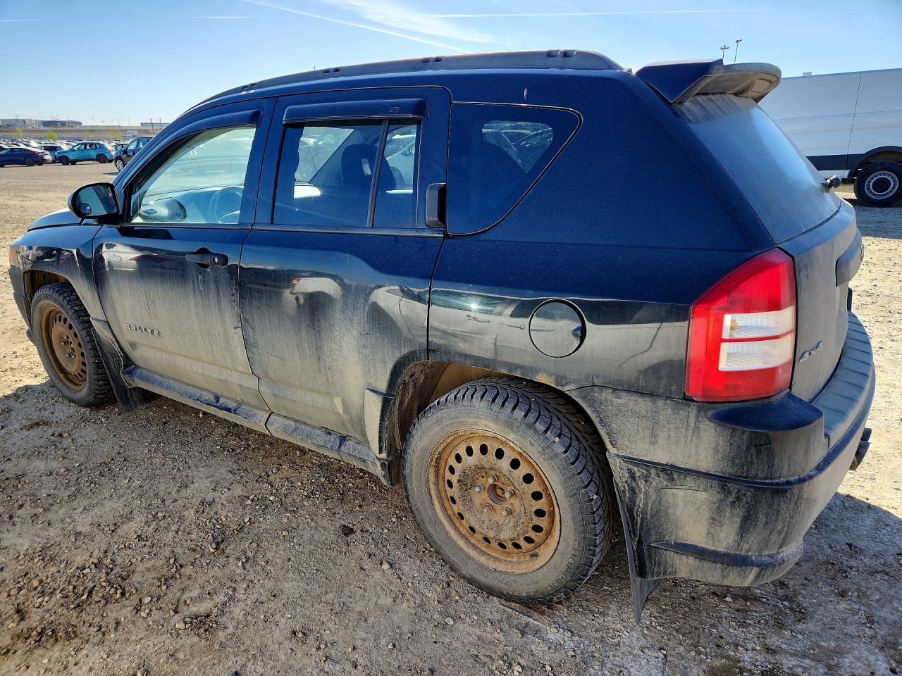 2009 Jeep Compass VIN 1J4FF47B59D105849 photo 2