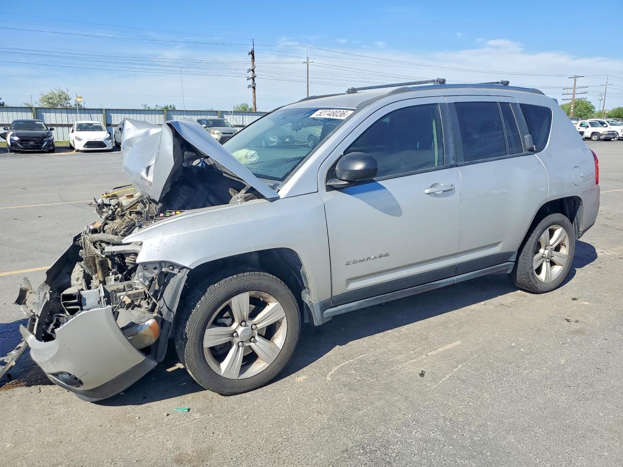 2012 JEEP Compass VIN 1C4NJCBA7CD652542 photo 1