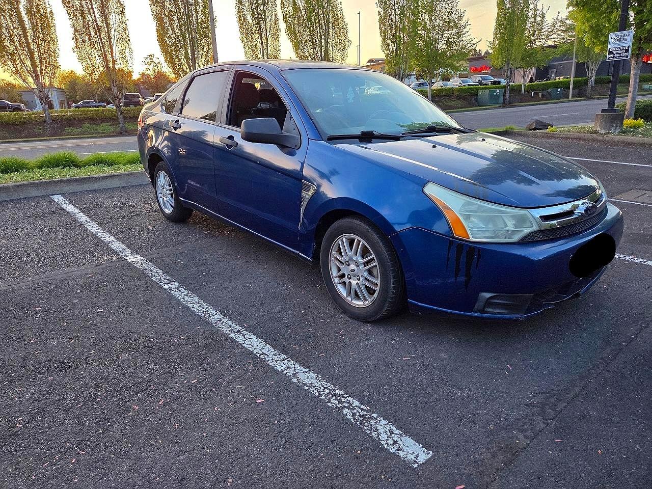 2009 Ford Focus VIN 1FAHP35N29W118507 photo 1