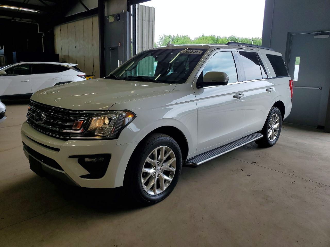 2021 Ford Expedition VIN 1FMJU1JT0MEA10409 photo 1