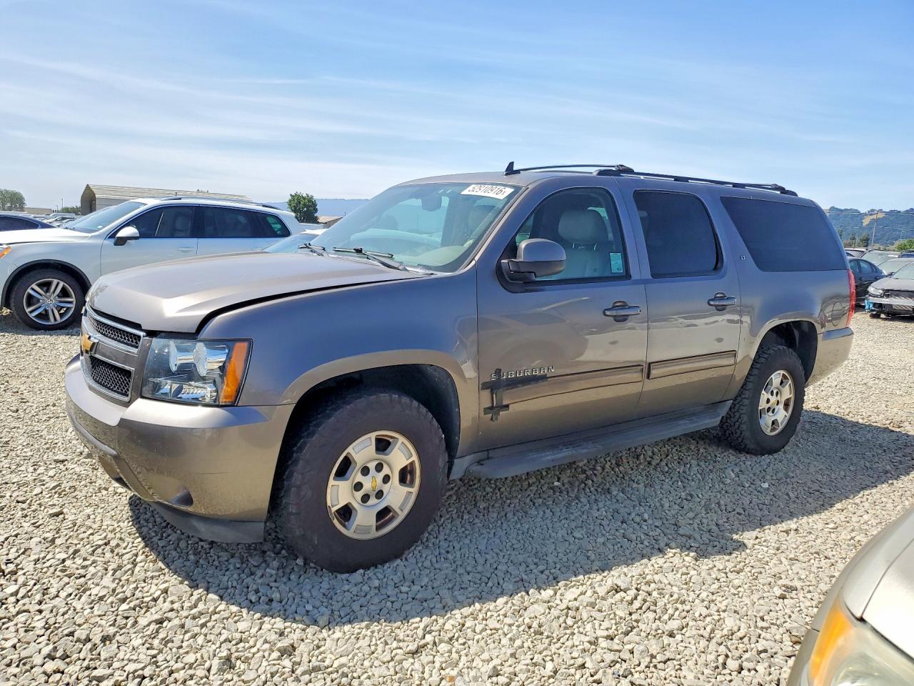 2012 Chevrolet Suburban VIN 1GNSKJE7XCR191707 photo 1