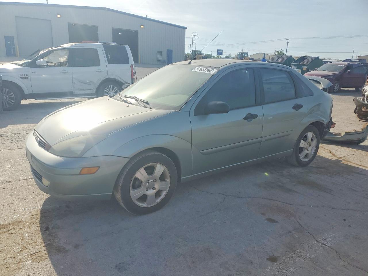 2003 Ford Focus VIN 1FAHP38333W200358 photo 1