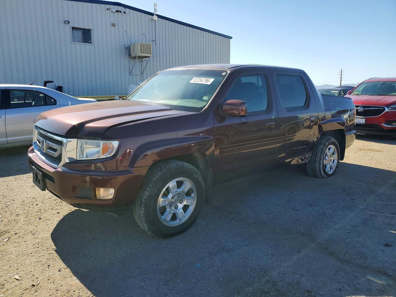 2011 Honda Ridgeline VIN 5FPYK1F41BB010965 photo 1