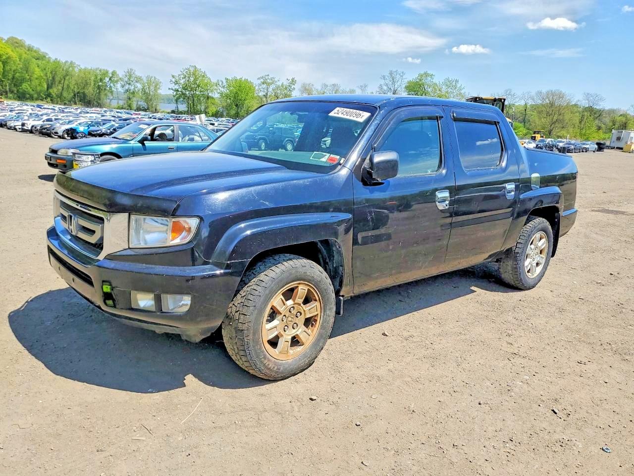 2011 Honda Ridgeline VIN 5FPYK1F48BB004242 photo 1