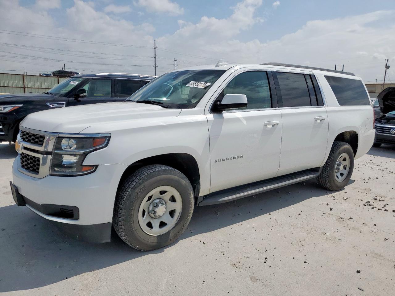 2019 Chevrolet Suburban VIN 1GNSCKEC4KR239670 photo 1