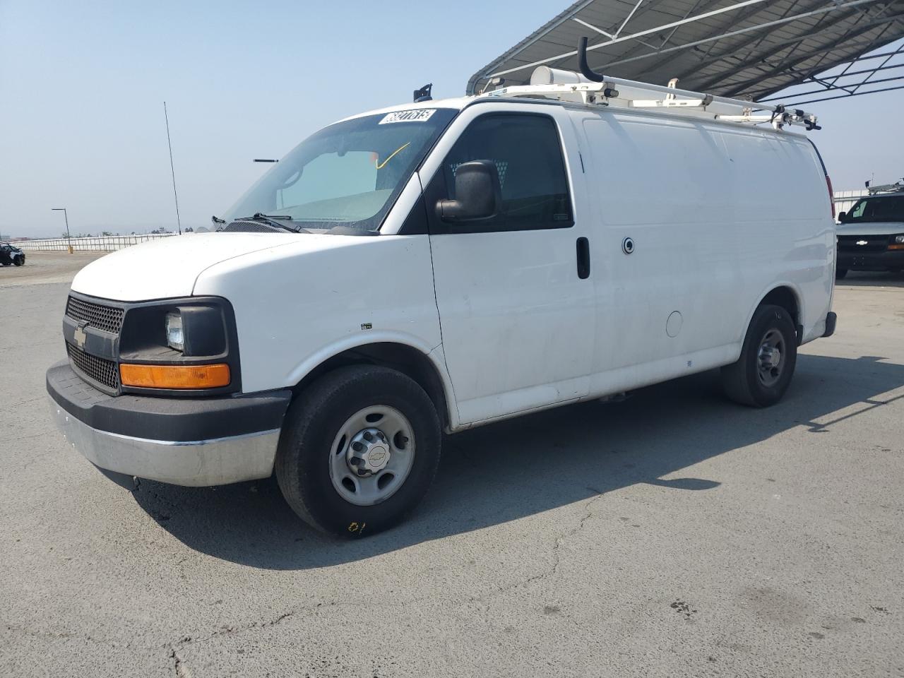 2014 Chevrolet Express VIN 1GCWGFCB7E1113614 photo 1