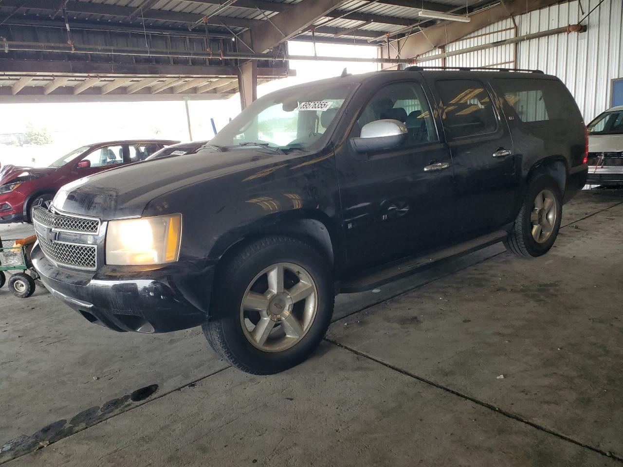 2007 Chevrolet Suburban VIN 3GNFC16067G214518 photo 1