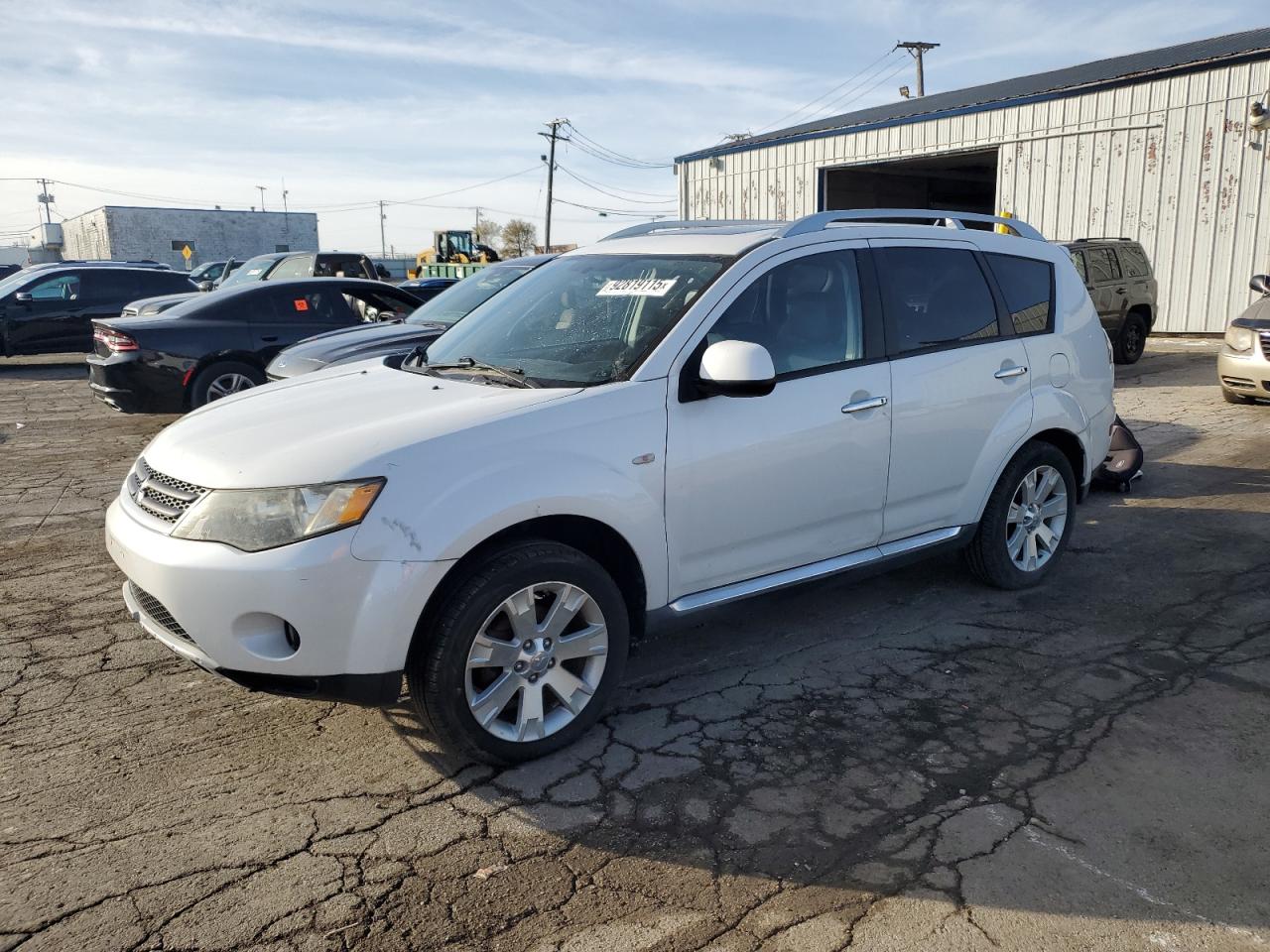 2009 Mitsubishi Outlander VIN JA4LT31W29Z010606 photo 1